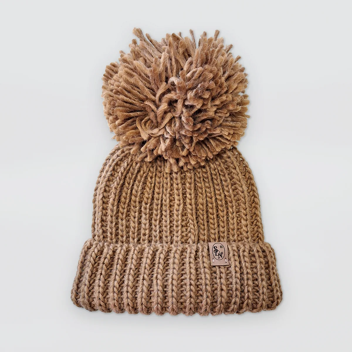 Knitted Hats With Pompoms